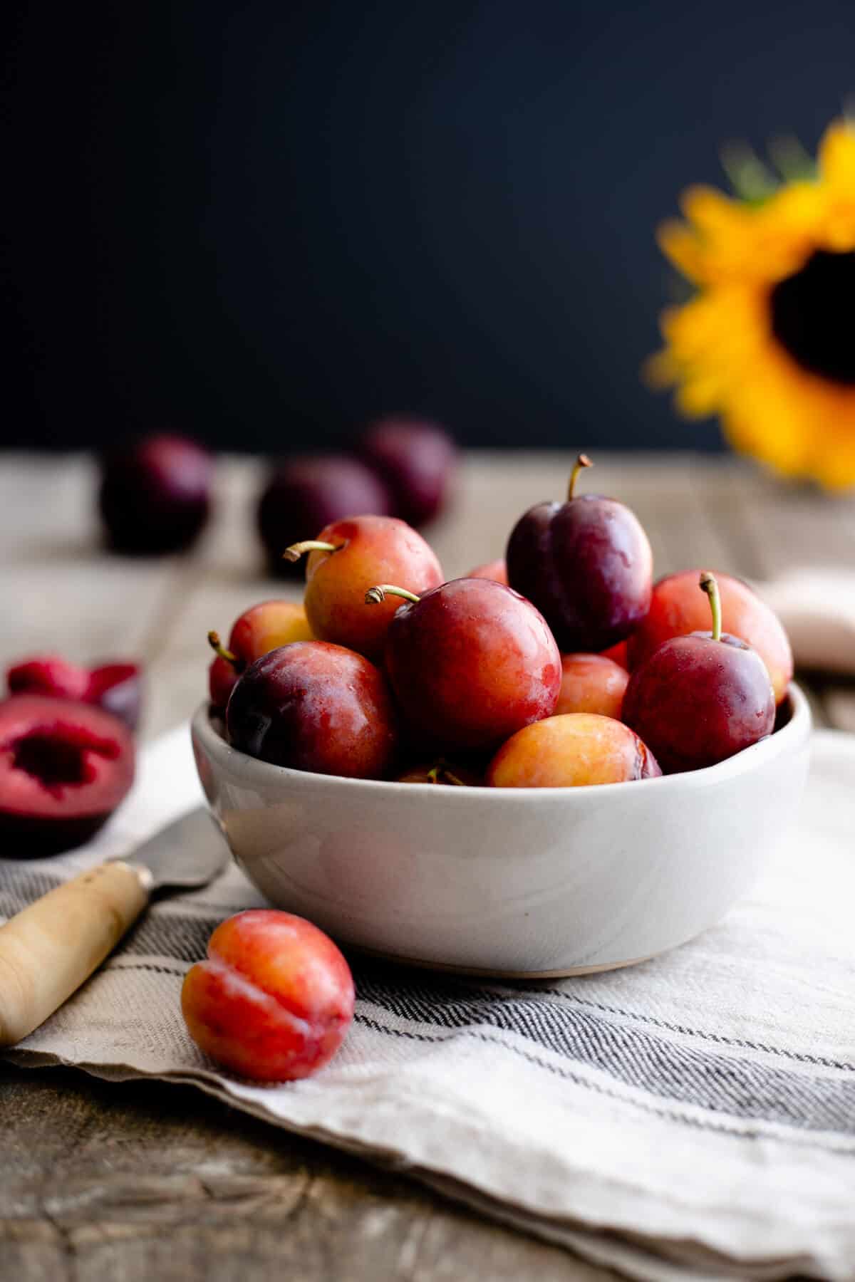 Small bowl of fresh plums