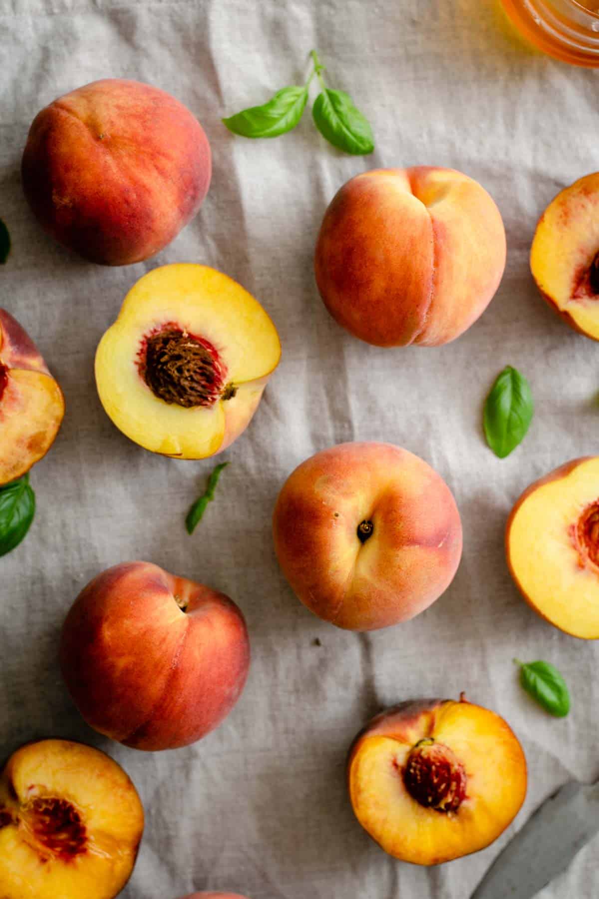 Fresh peaches on linen tablecloth