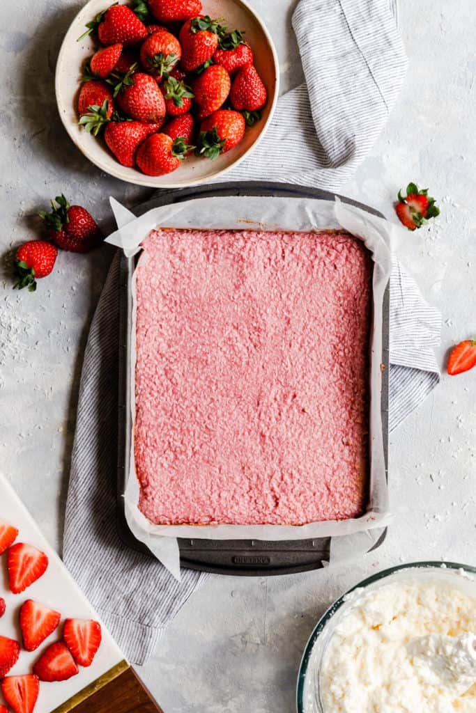 top view of baked strawberry coconut mix in a baking tin