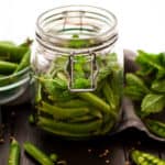 Quick pickled sugar snap peas with mint. Absolutely delicious combination of flavors and spices, super easy to prepare! Yummy and crunchy peas to enjoy anytime! | via@ annabanana.co