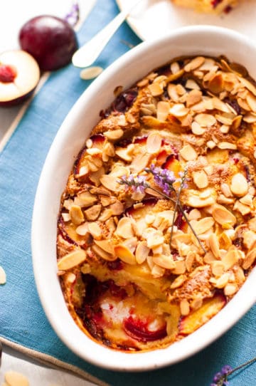 This vegan plum clafoutis is a perfect pud, studded with sharp fruit, delicately creamy centre, and a drop of brandy. Delicious and easy way to enjoy any seasonal fruit! | via@ ananabanana.co