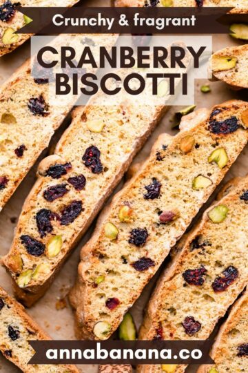 cranberry biscotti slices with pistachio nuts and text overlay.
