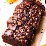 pumpkin chocolate loaf slices with chocolate chips on top.