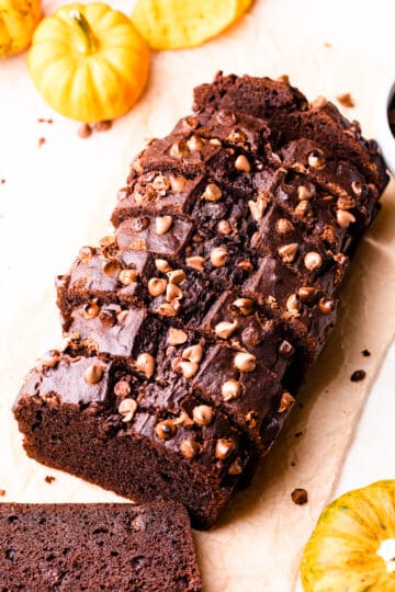 pumpkin chocolate loaf slices with chocolate chips on top.