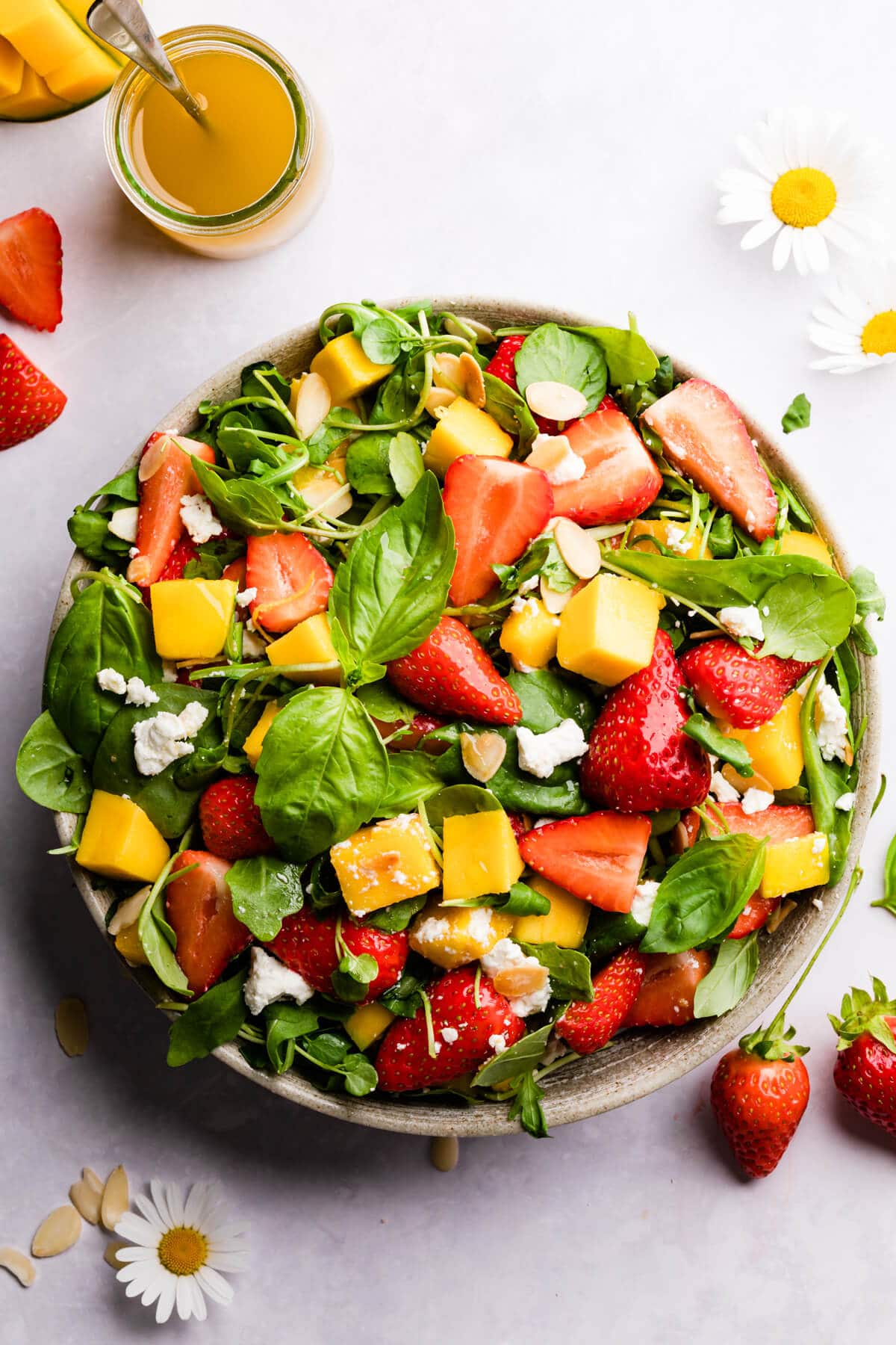 top view close up of fresh strawberry salad with mango and feta cheese