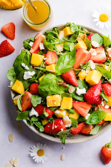 top view close up at salad with mango and strawberries