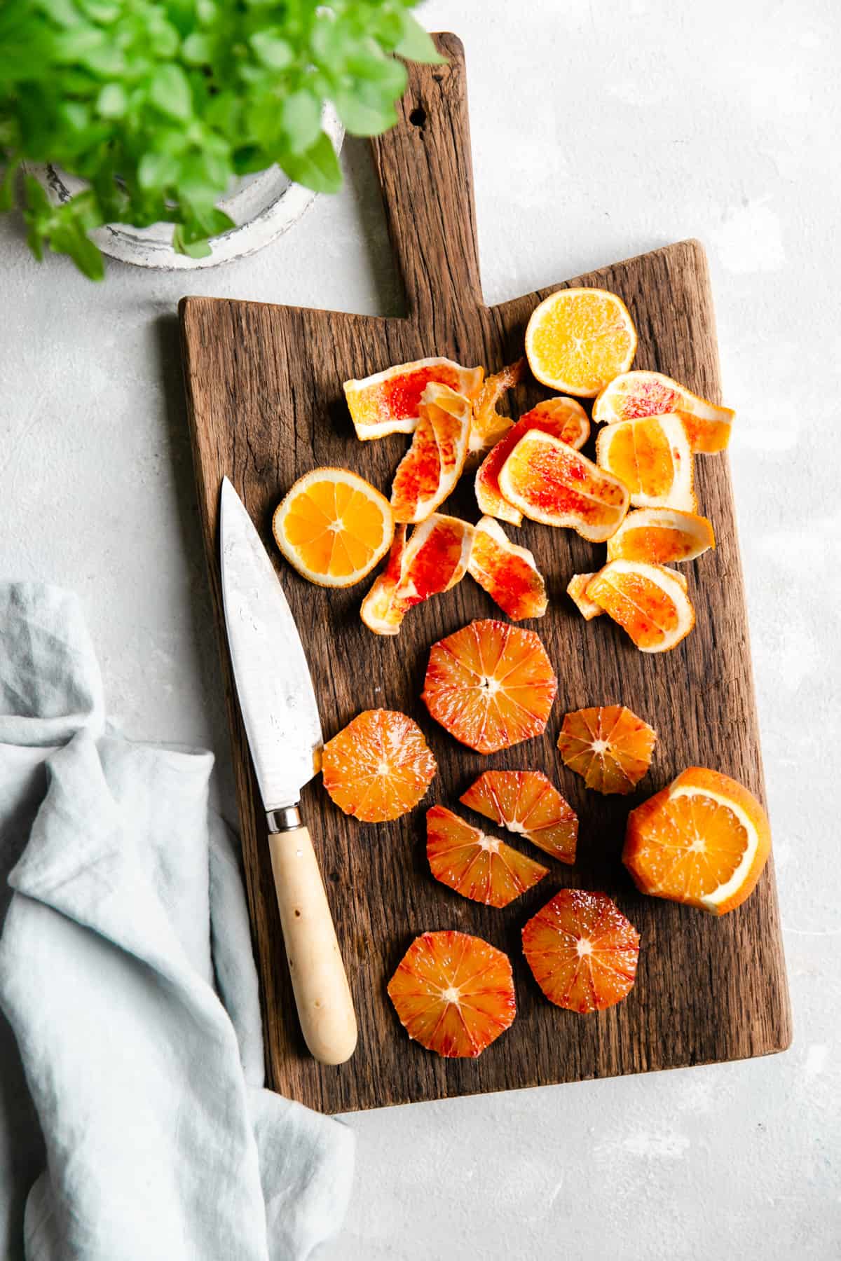slices of blood orange on a wooden chopping board