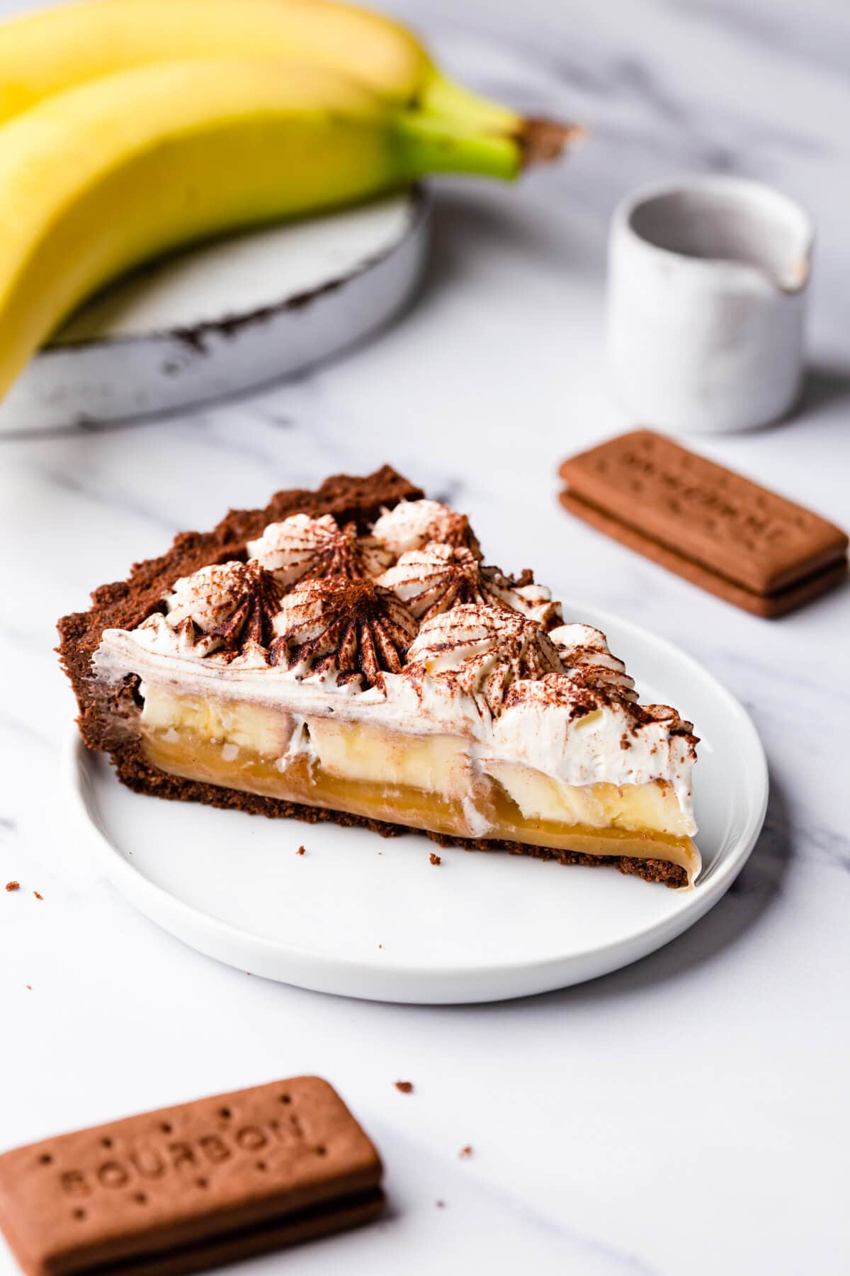 side close up at a slice of vegan banoffee pie on a dessert plate