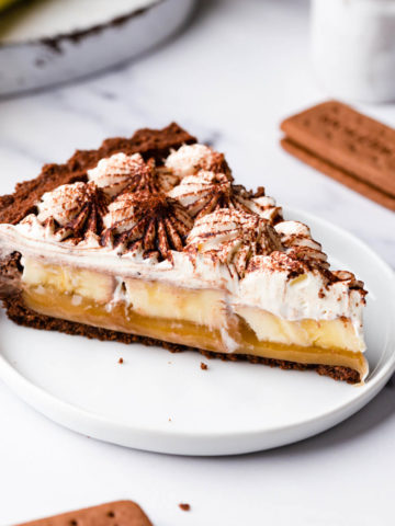 side close up at a single slice of vegan banoffee pie on a small plate