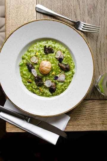 overhead shot of wild garlic and Dorset snail risotto