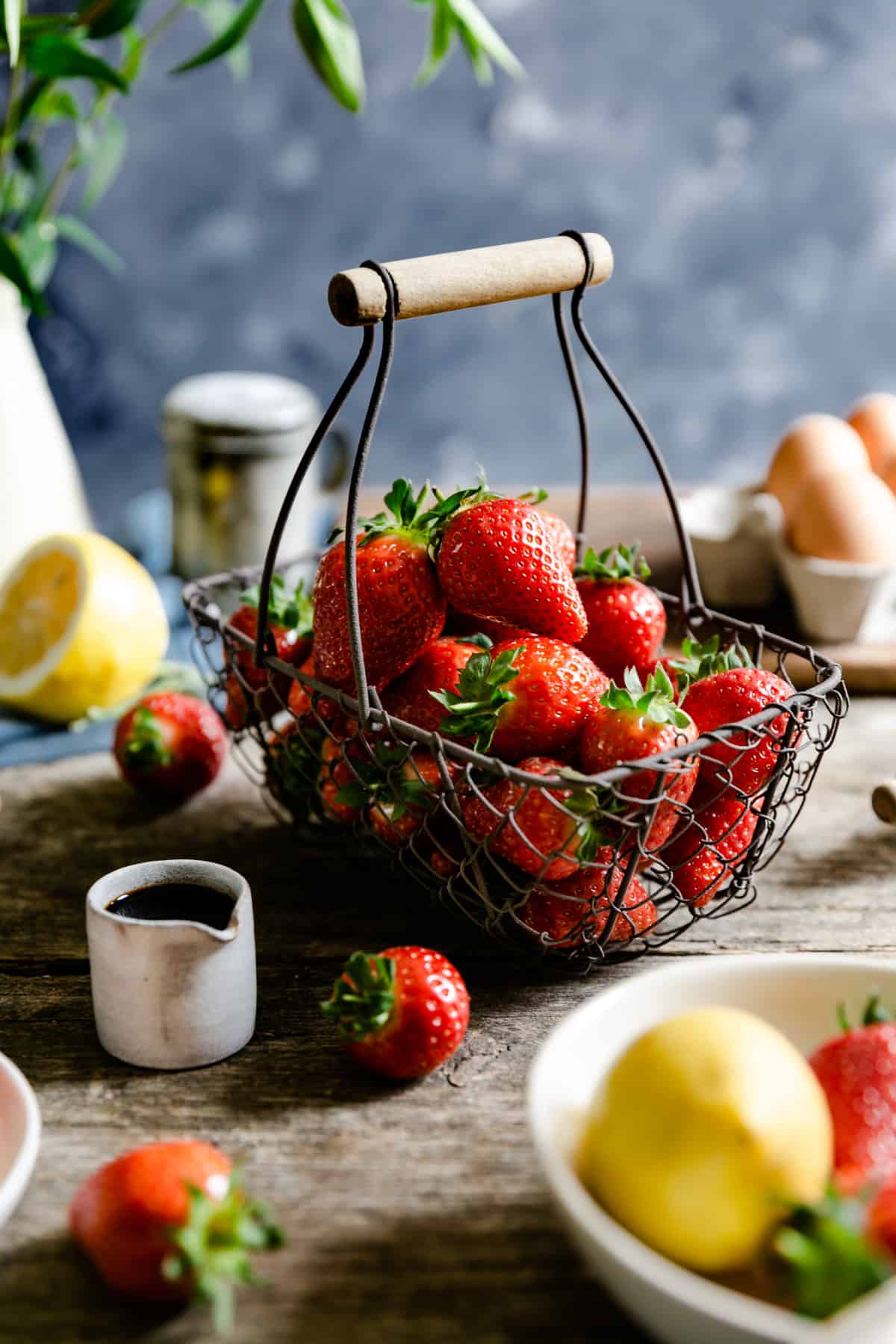 small wire basket filled up with fresh strawberries