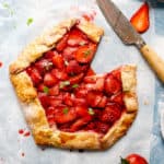 top view of strawberry galette with one slice cut off