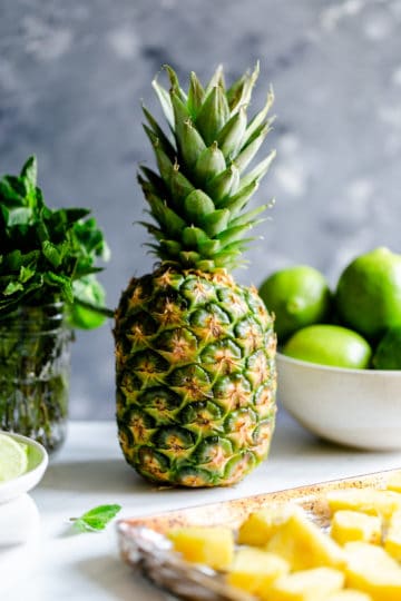 large fresh pineapple and some fresh mint