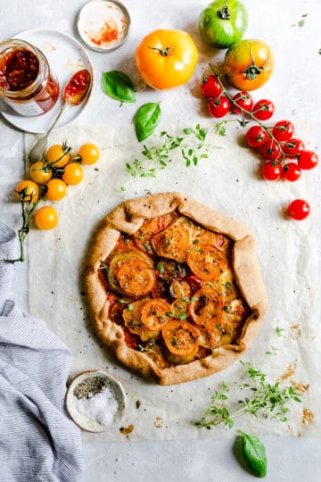top view of the summer tomato galette topped with frsh thyme