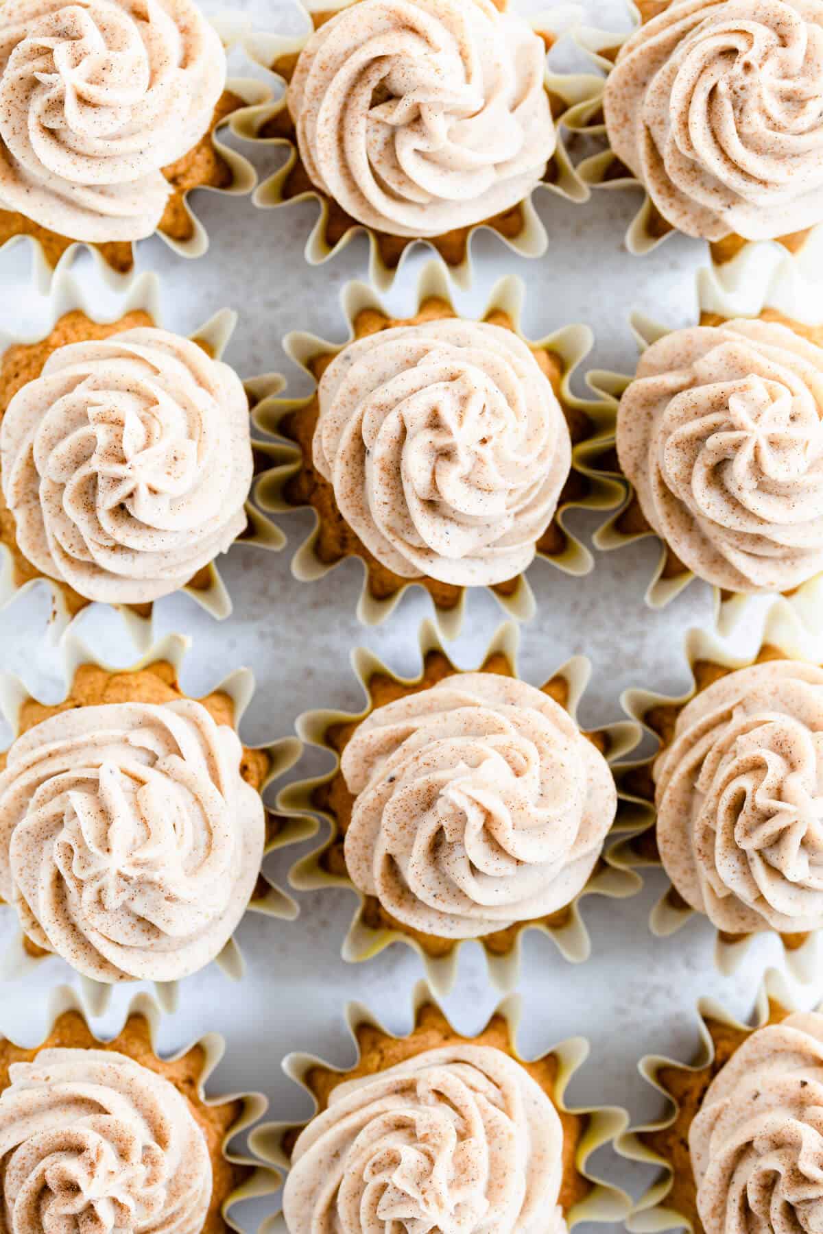 overhead close up of pumpkin cupcakes with chai frosting