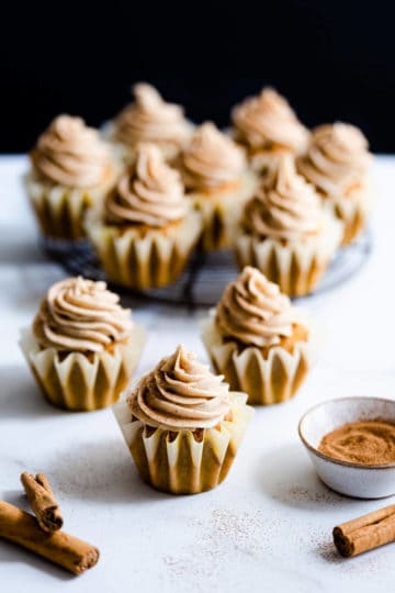 side shot of cupcakes topped with chai frosting