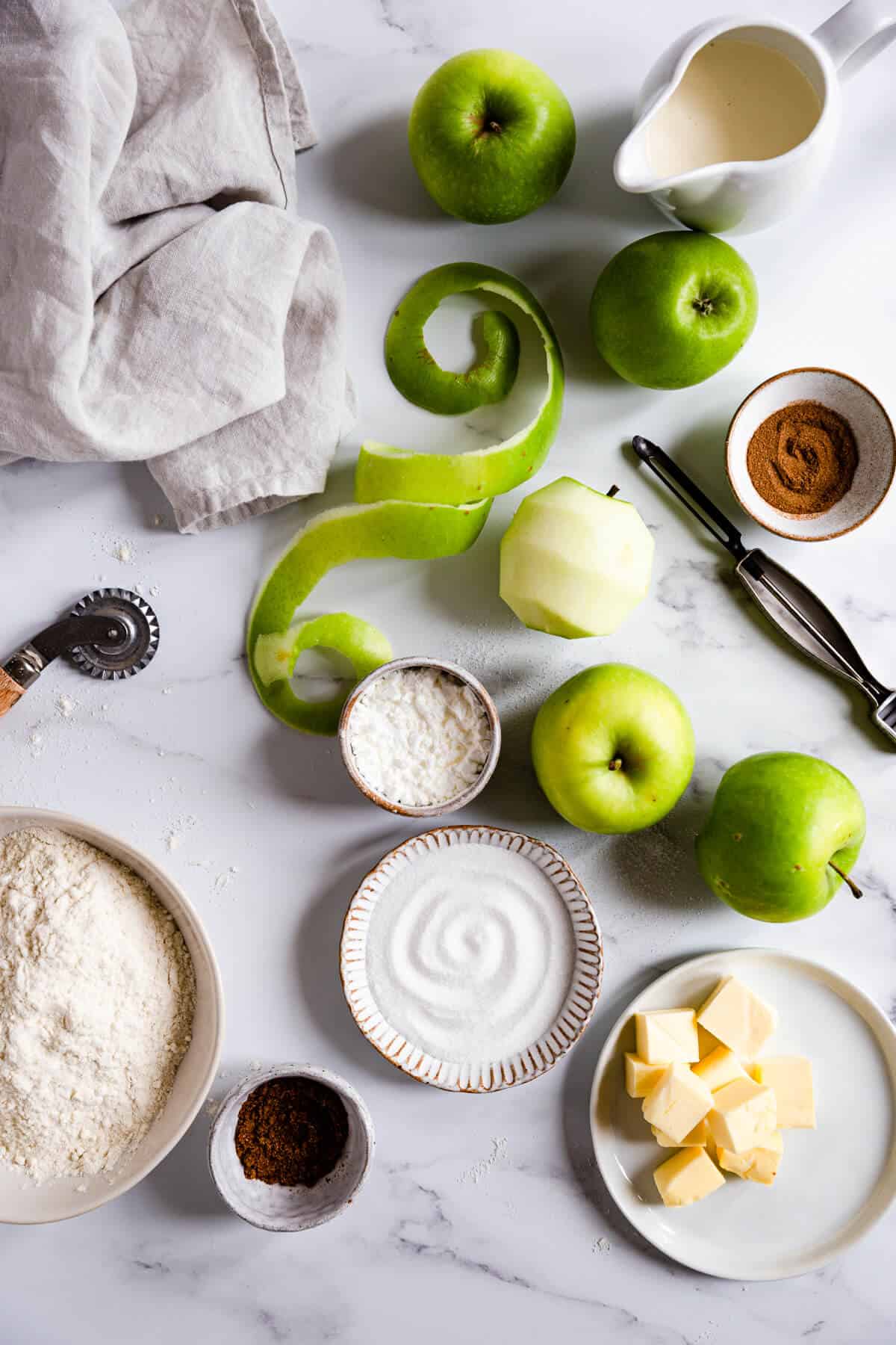 top view of some of the ingredients for an apple pie 