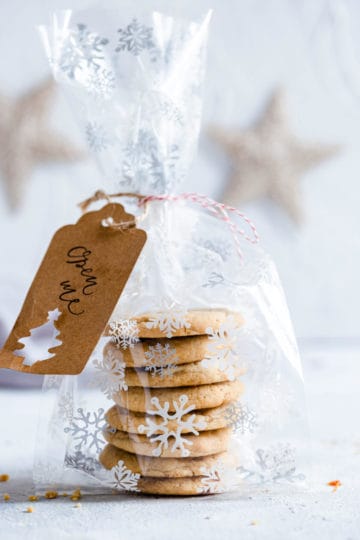 a side sngle shot stack of cookies wrapped in a festive foil