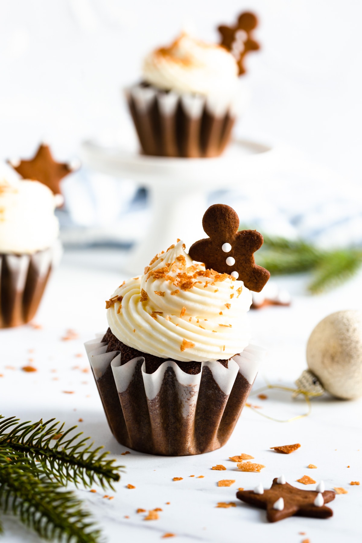 side close up of gingerbread cupcake with cream cheese frosting