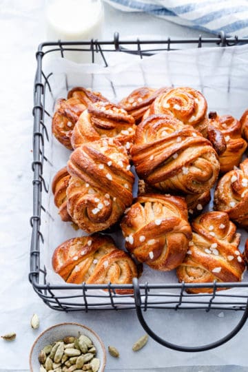 side close up of cardamom buns in a wired basket