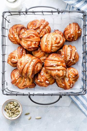 top view of cardamom buns in a wired basket
