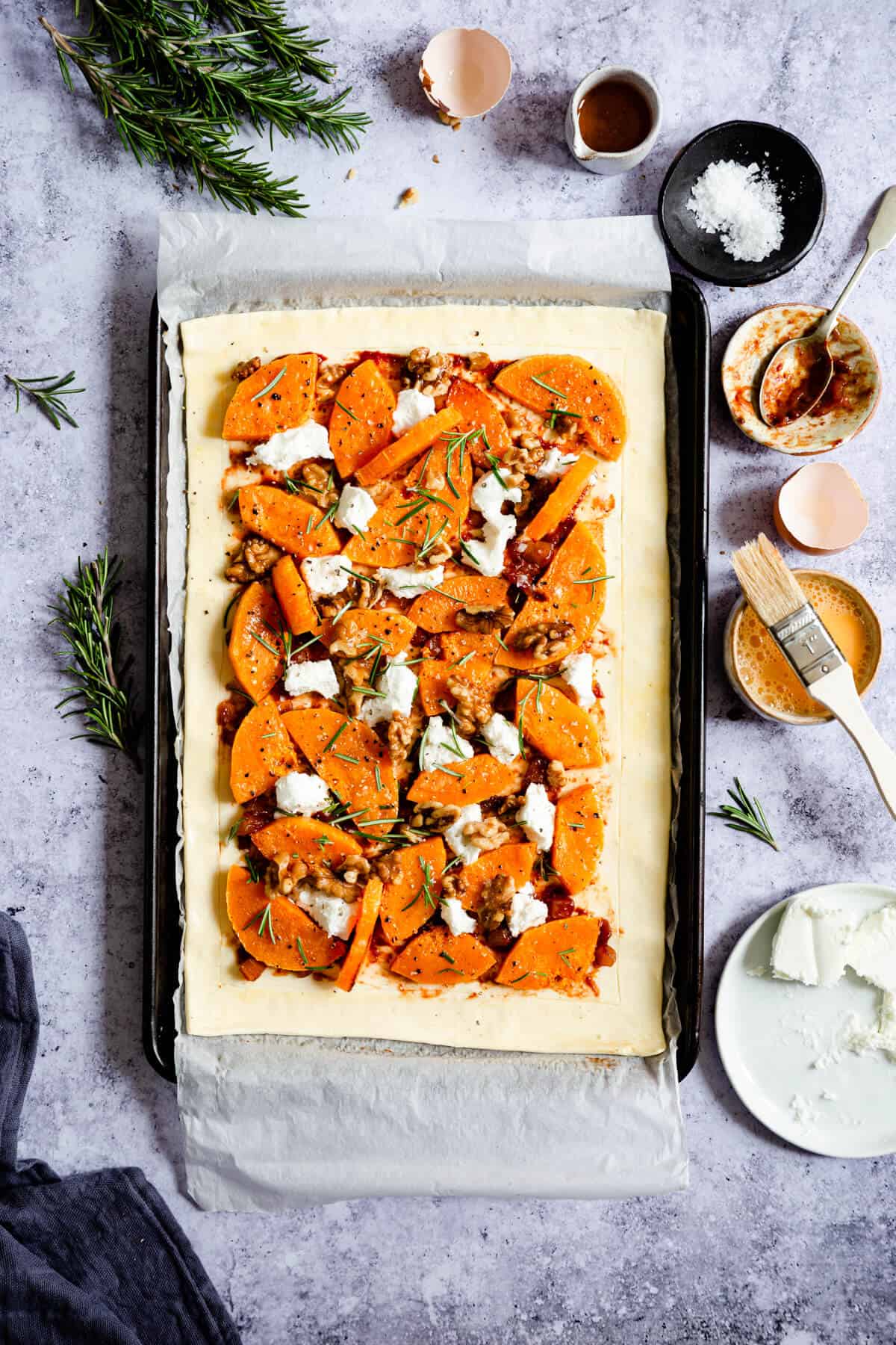 overhead shot of unbaked butternut squash and goats' cheese tart
