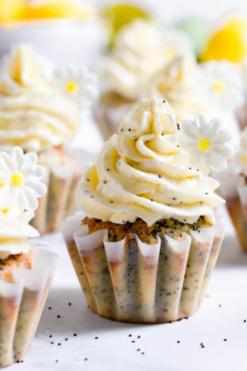 close up of lemon cupcake topped with buttercream