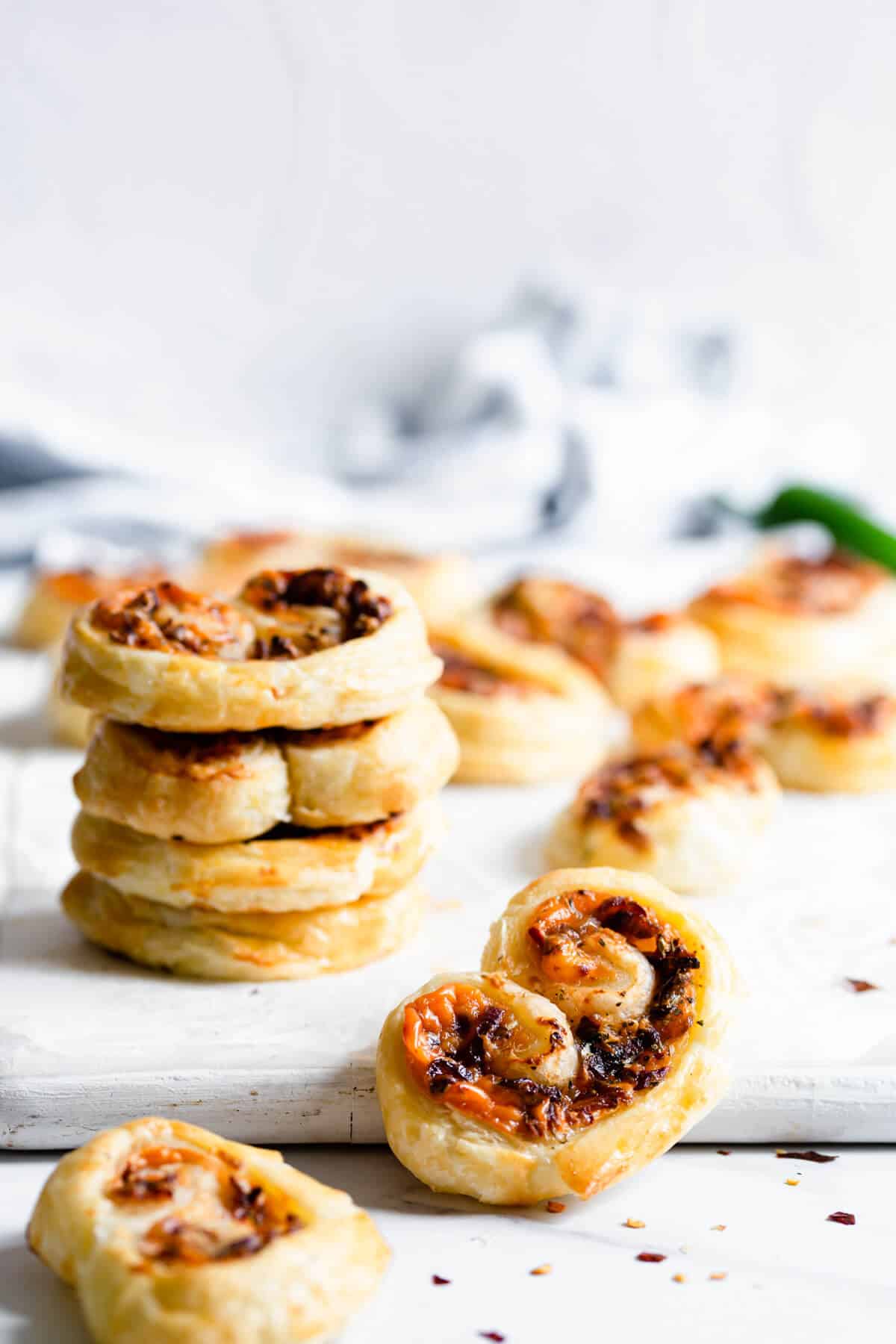 close up at puff pastry palmier filled with cream cheese and caramelised onion