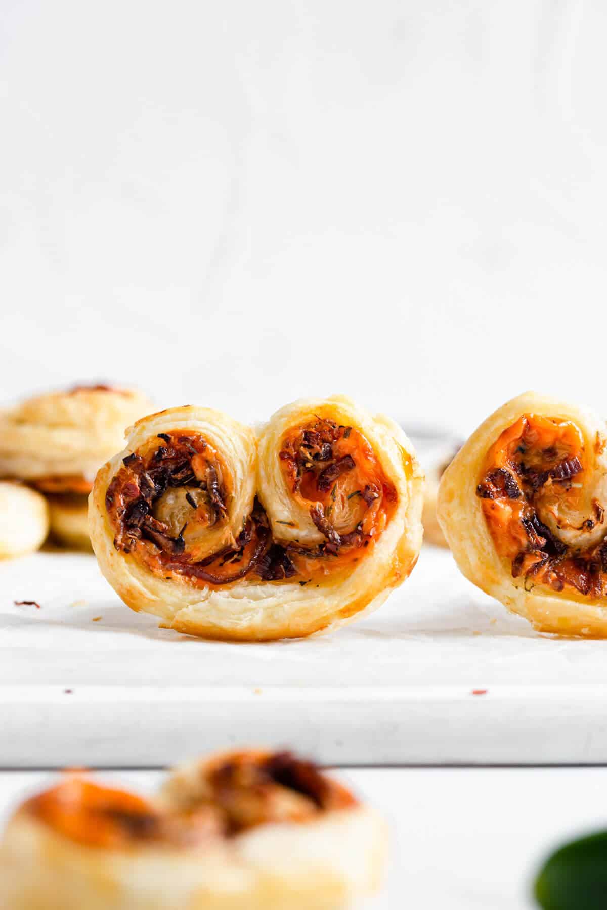 side shot of savoury palmiers with caramelised onion