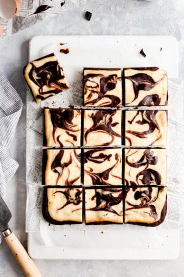 overhead shot of cheesecake brownies cut into 12 squares