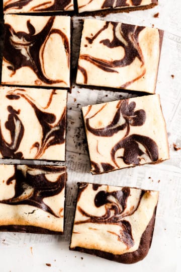 overhead close up of sliced brownies with chocolate swirls on top