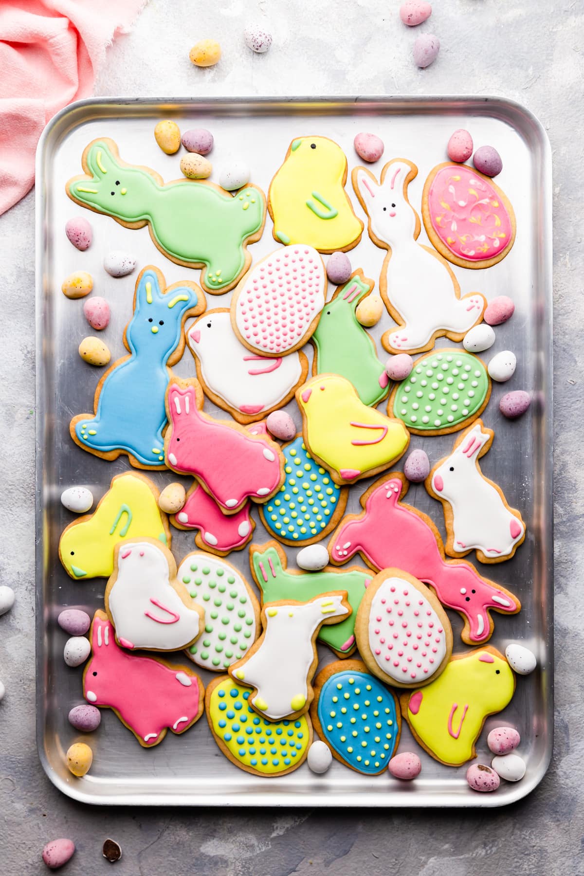 top view at Easter sugar cookies with icing on a baking sheet