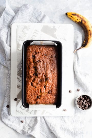 top view of baked chocolate chip banana bread in a tin