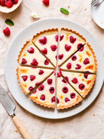 overhead shot of 8 slices of mascarpone tart with berries