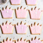 overhead view of sugar cookies decorated with pink and purple icing