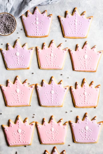 overhead view of sugar cookies decorated with pink and purple icing
