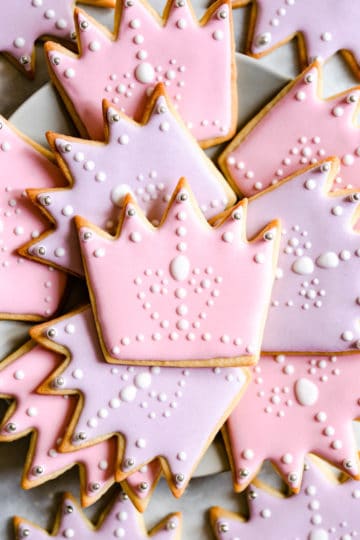 super close up at crown-shaped sugar cookies with royal icing