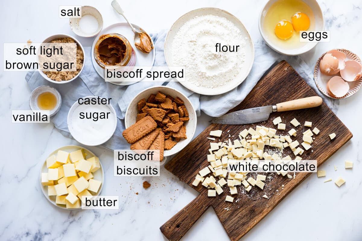 overhead view of the ingredients for biscoff white chocolate blondies with text labels