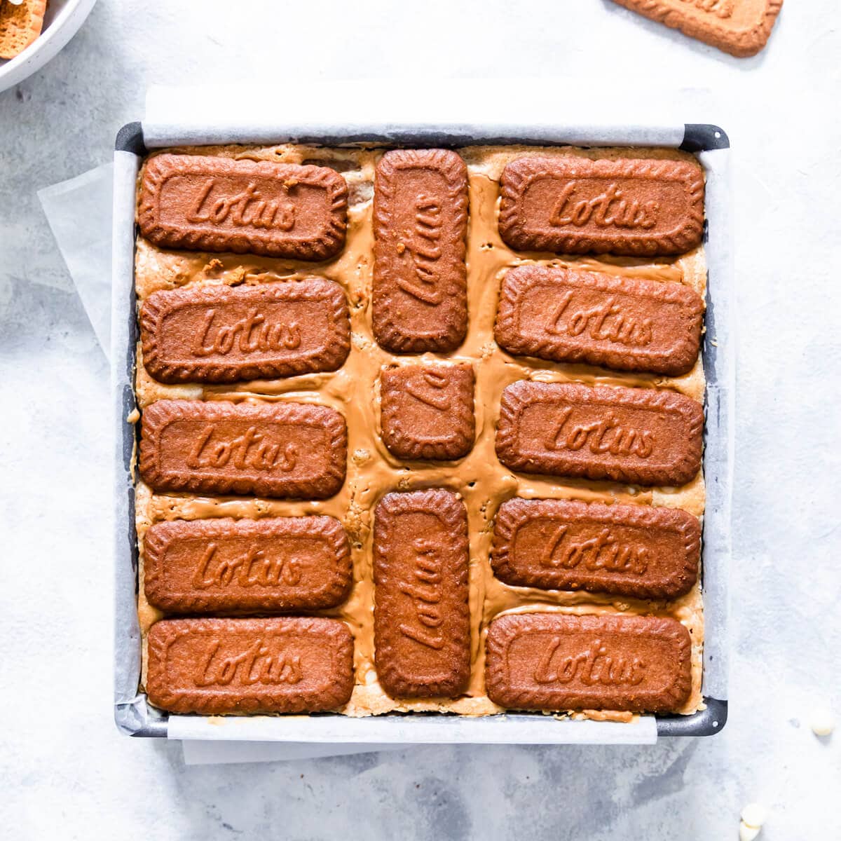 overhead view of the baked biscoff blondie in the baking tin