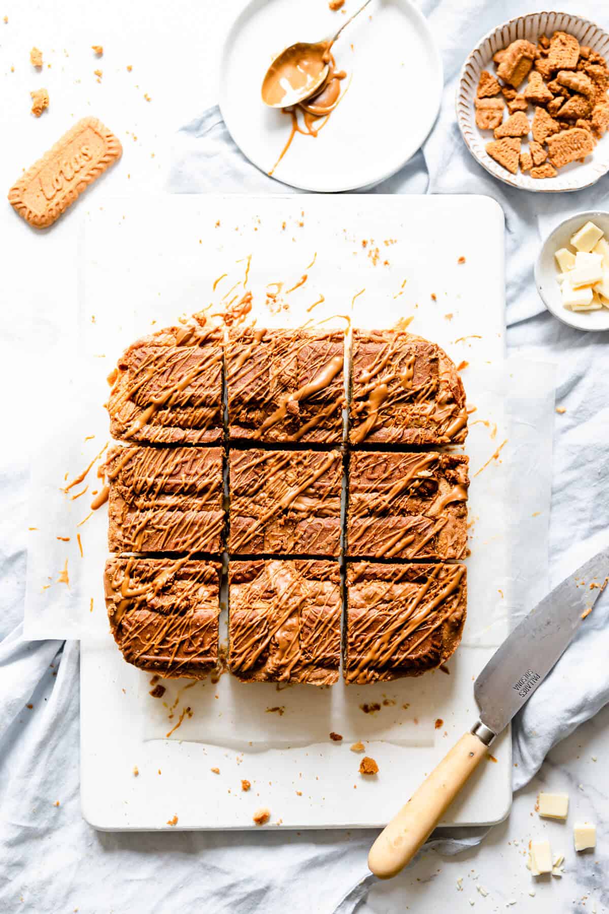 overhead shot of biscoff blondies cut into 9 square slices