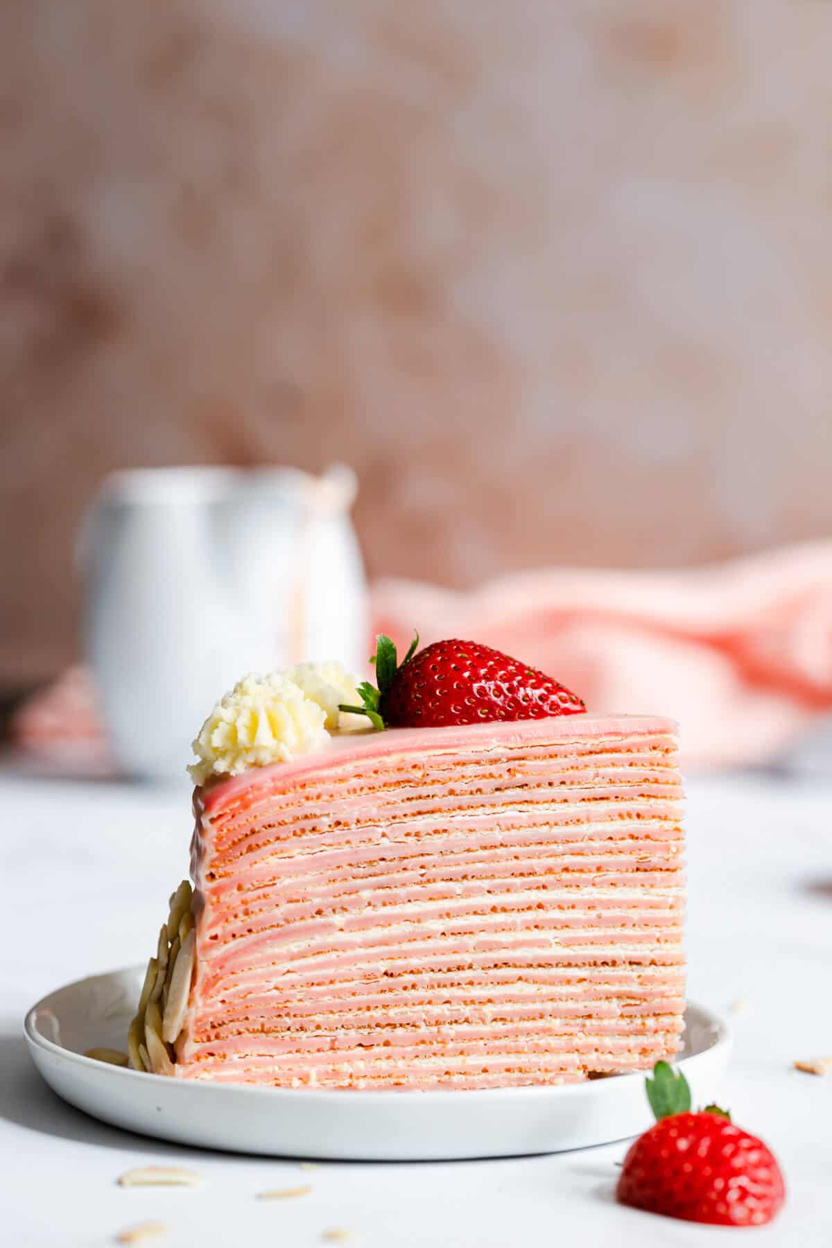 super close up of a slice of crepe cake on a small plate