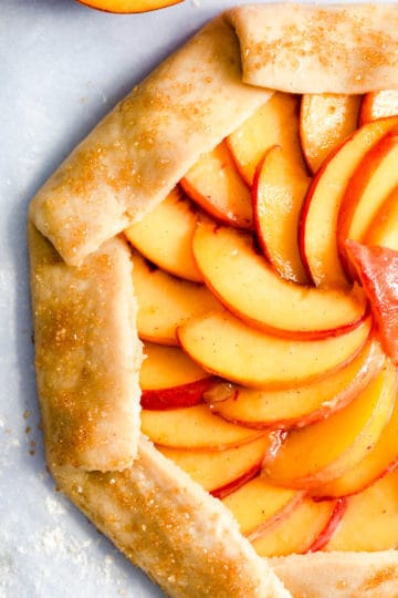 top view super close up of unbaked peach galette