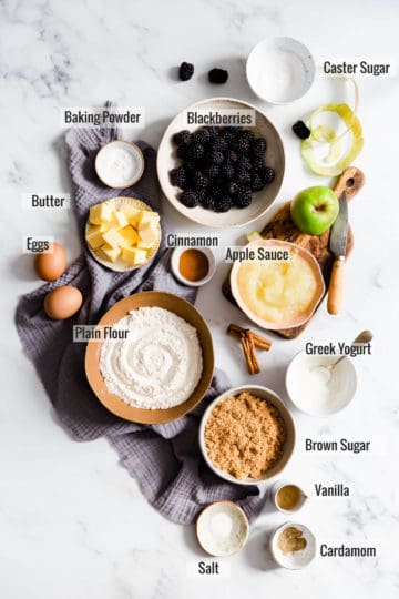 overhead shot of the ingredients for spiced apple and blackberry cupcakes with text overlay