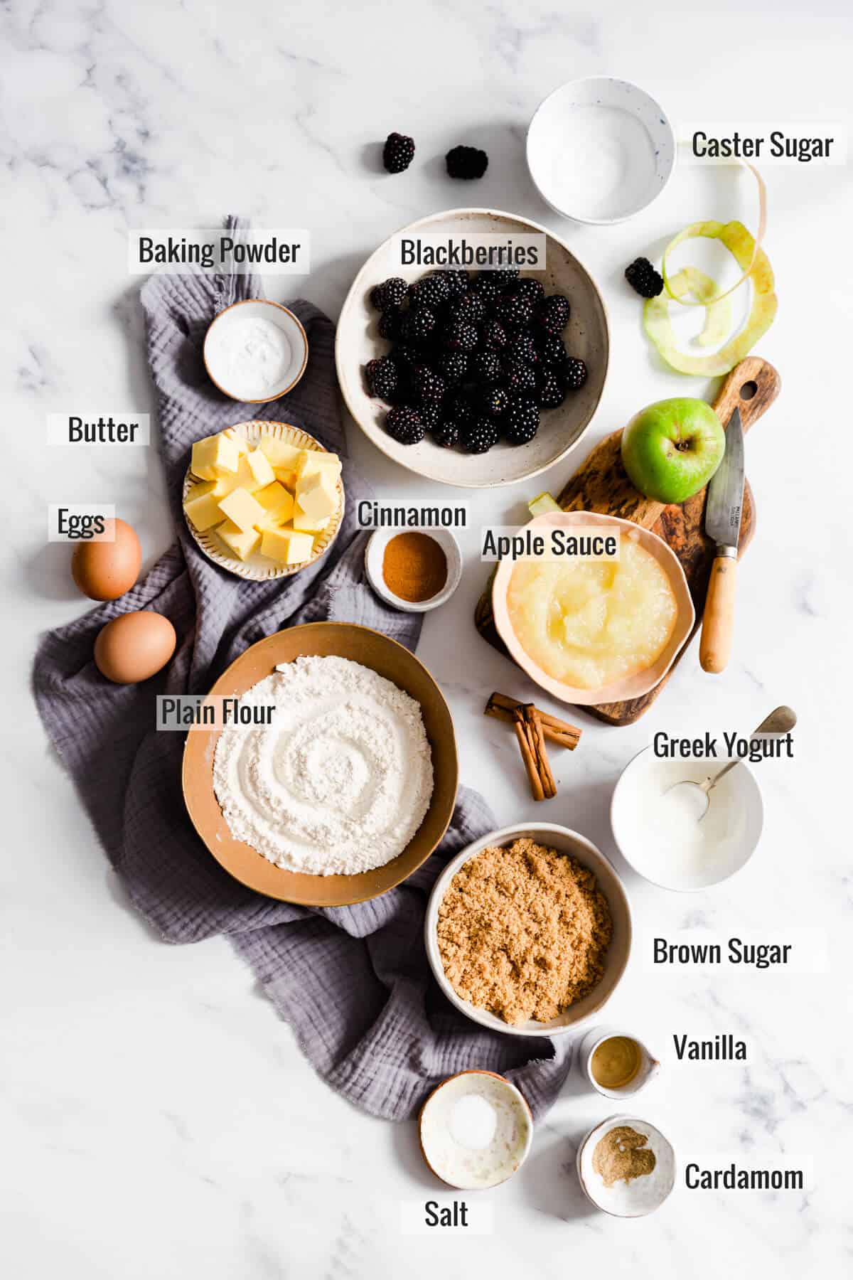 overhead shot of the ingredients for spiced apple and blackberry cupcakes with text overlay