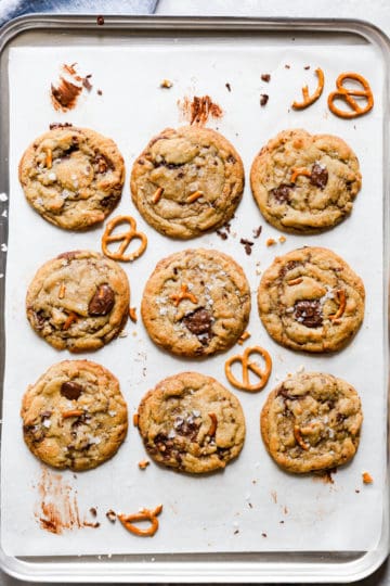 overhead shot of baking tray with cookies and pretzels