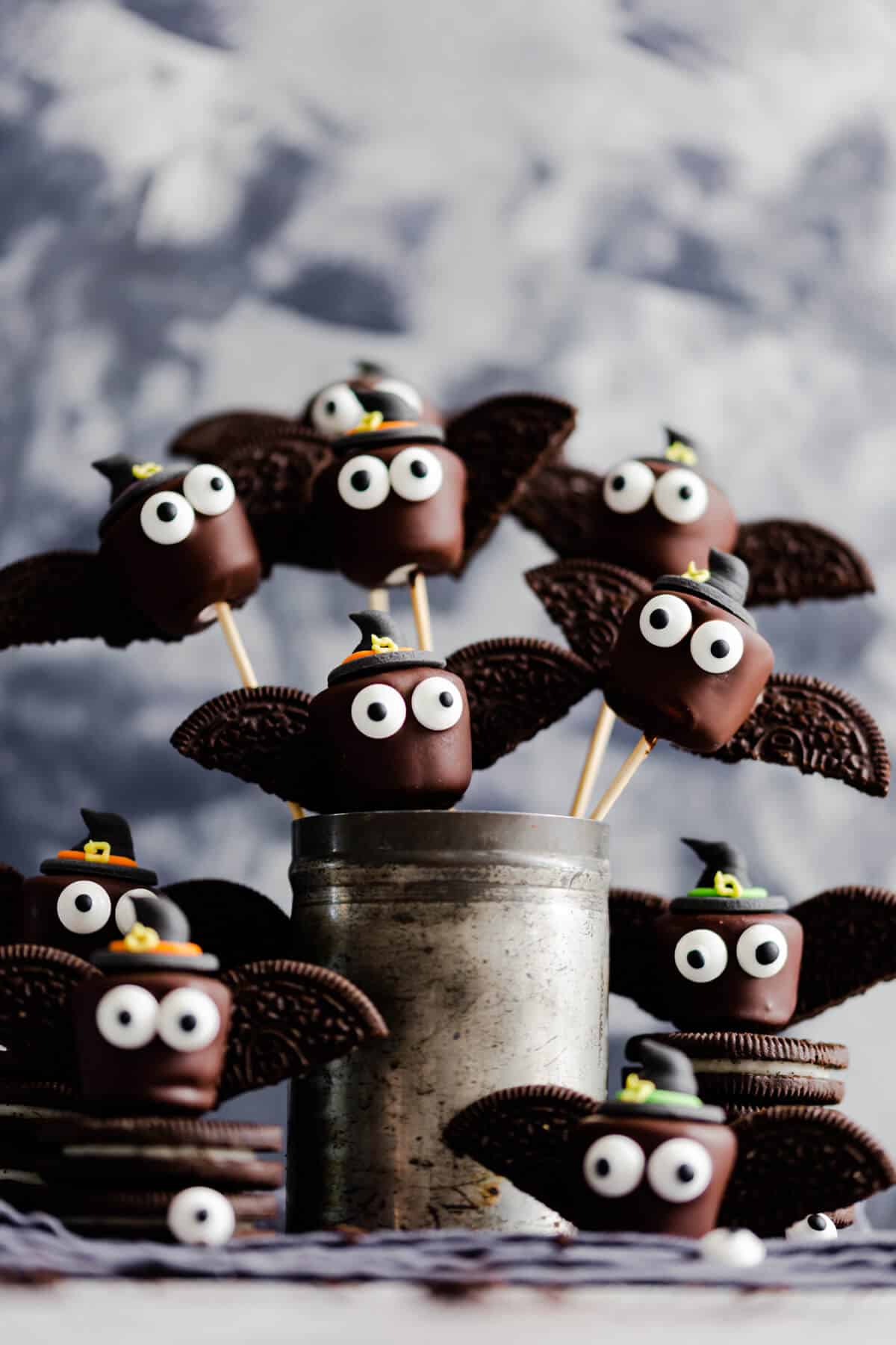 straight ahead shot at little chocolate marshmallow bats wearing witches hats