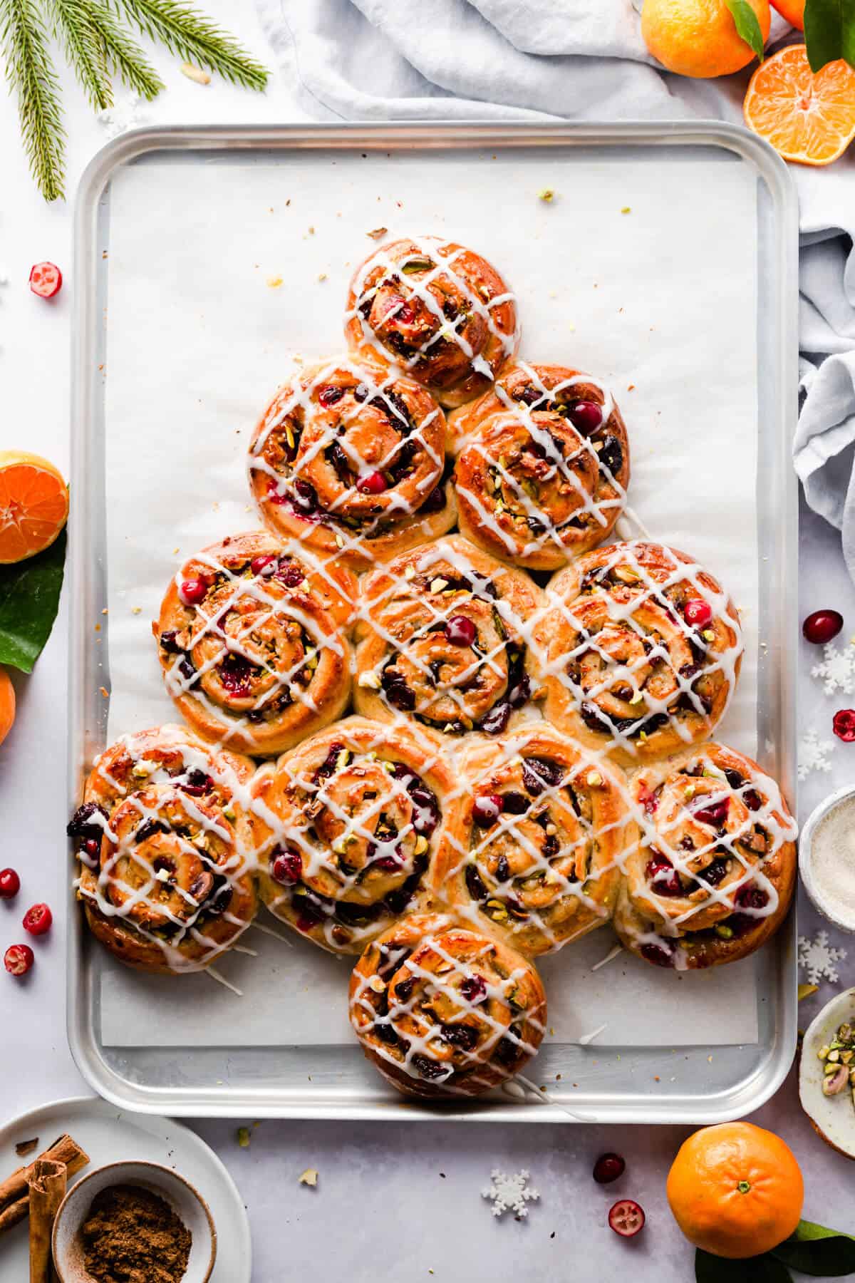 overhead shot of buns shaped into a Christmas tree and drizzled with sugar glaze