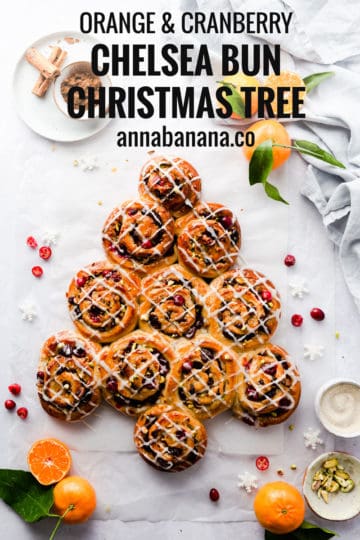 overhead shot of orange and cranberry Chelsea buns shaped into a Christmas tree with text overlay