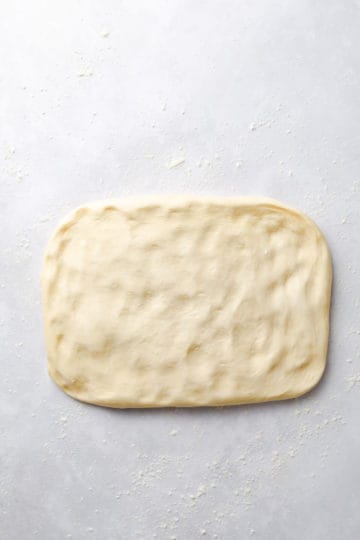 top view of soft dough stretched into rectangle