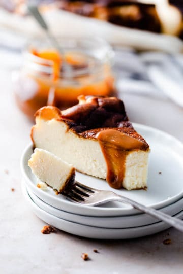 cheesecake wedge slice drizzled with caramel.